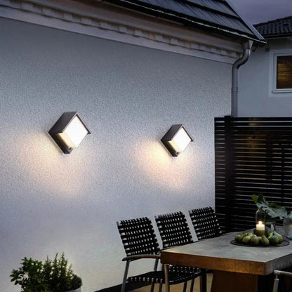 Two modern black decorbites led radar induction wall lamps with bright white LED panels for hotel garden and balcony lighting