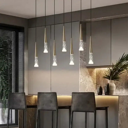 Modern pendant light decorbites led rain drop chandelier with gold metal tops and clear textured glass shades above island