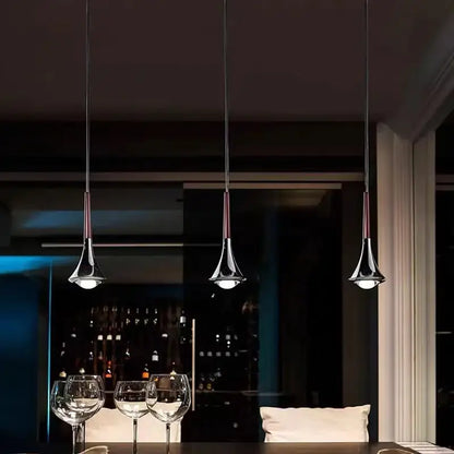 Three chrome conical pendant lights with dark cords as part of decorbites led rain staircase chandelier for indoor use