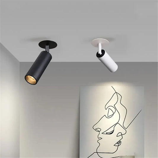 Two modern decorbites led recessed ceiling lights in matte black and white with sleek cylindrical design for kitchen use
