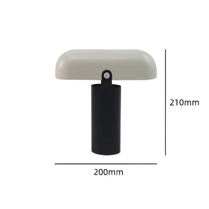 A decorbites led rechargeable table lamp with a matte off-white curved top and black cylindrical base for modern decor