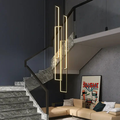 Modern gold-accented decorbites led rectangle pendant lighting hanging beside staircase for modern living room decor