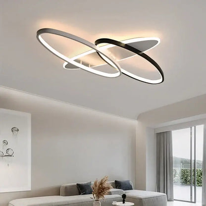 Modern minimalist decorbites led rectangular chandelier with two interlocking black and silver oval rings and integrated led lighting