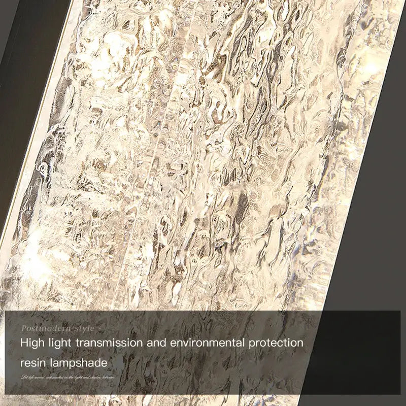 Silver-toned DecorBites LED resin wall lamp with textured wavy surface for bedroom and living room decor