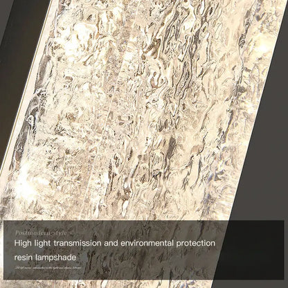 Silver-toned DecorBites LED resin wall lamp with textured wavy surface for bedroom and living room decor