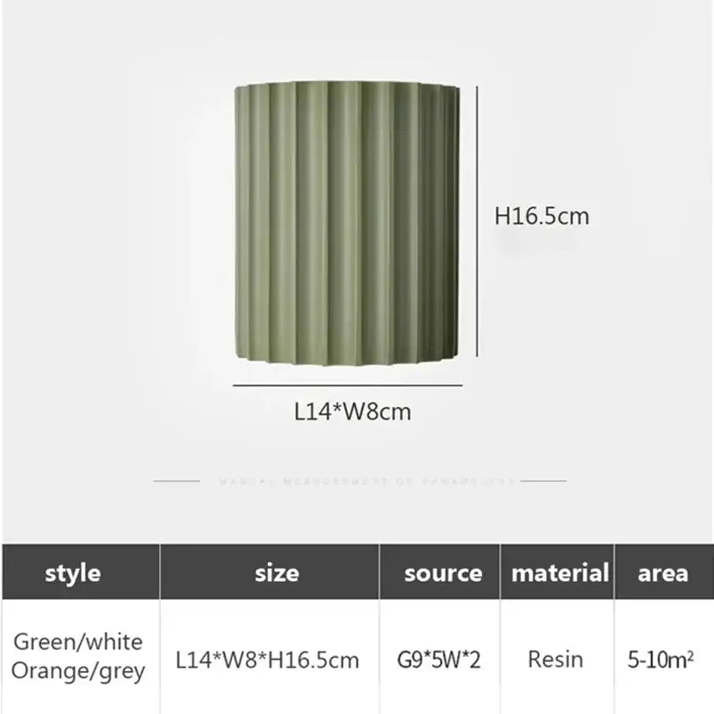 Olive green ribbed resin cylindrical vase complementing decorbites led resin wall sconces for minimalist living spaces
