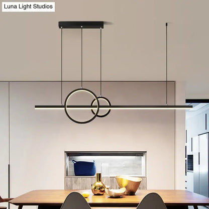 Modern black led restaurant island pendant with sleek circular rings and warm white lighting suspended by thin cables