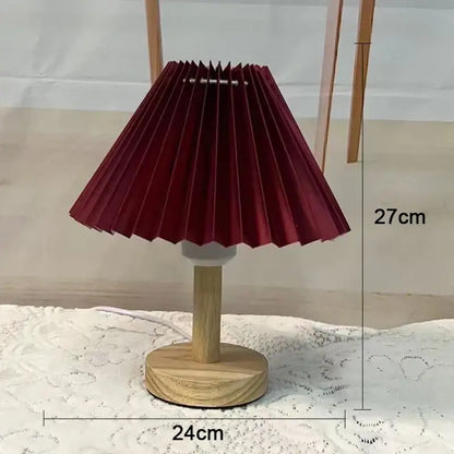 A maroon pleated paper lampshade on a light wood base decorbites led retro table lamp with usb plug for interior lighting