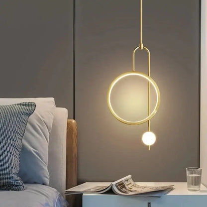 Gold-toned minimalist decorbites led ring pendant chandelier with circular ring and spherical bulb for dining and living areas