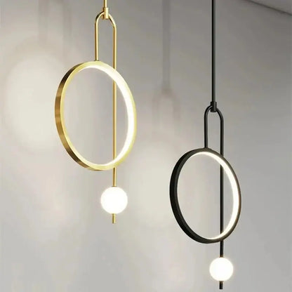 Modern decorbites led ring pendant chandelier with circular led rings and spherical bulbs in gold and black finishes