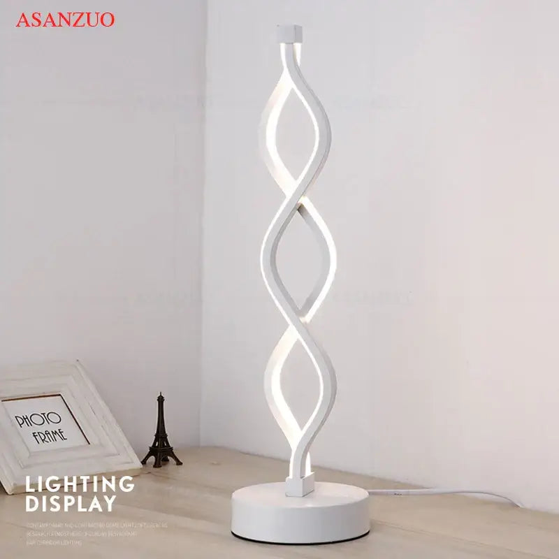 White asanzuo led ring table lamp with sleek twisted design and illuminated inner curves for modern bedroom lighting