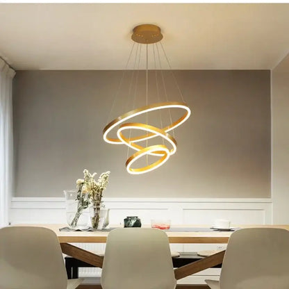 Gold-toned DecorBites™ led rings chandelier with spiral pendant light and illuminated led rings for living room and dining room lighting