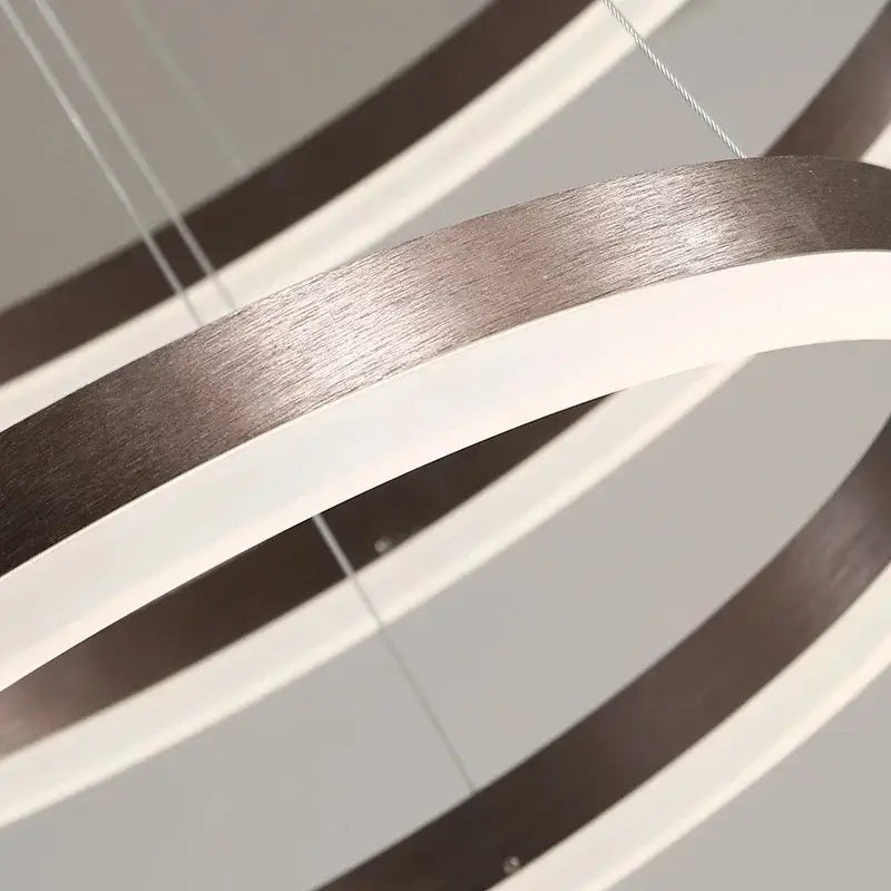 Modern minimalist DecorBites™ led rings chandelier with brushed metallic and matte white concentric rings for living room lighting