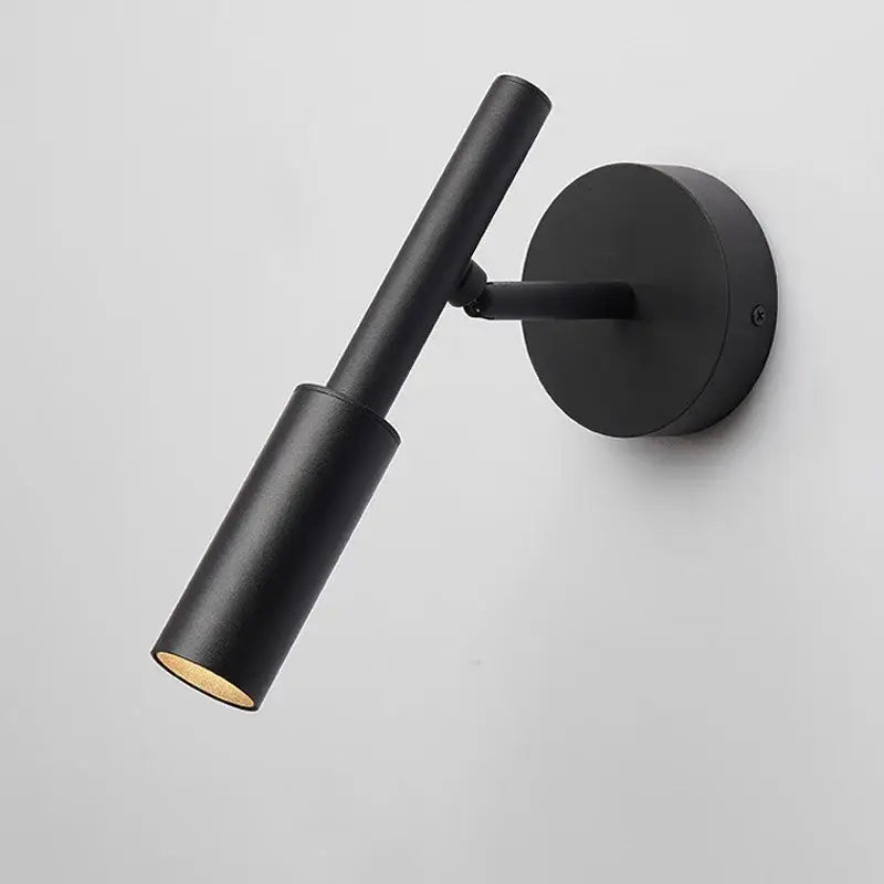 Black matte finished decorbites™ led rotatable wall lamp with cylindrical head and circular base for bedroom use