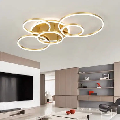Modern gold-toned DecorBites™ led round ceiling chandelier with overlapping circular rings for living rooms and bedrooms