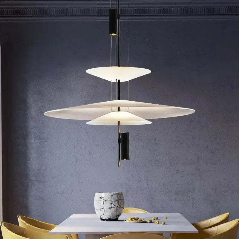 Modern led saucer chandelier with layered white translucent disc shades suspended by black rods for dining room decor