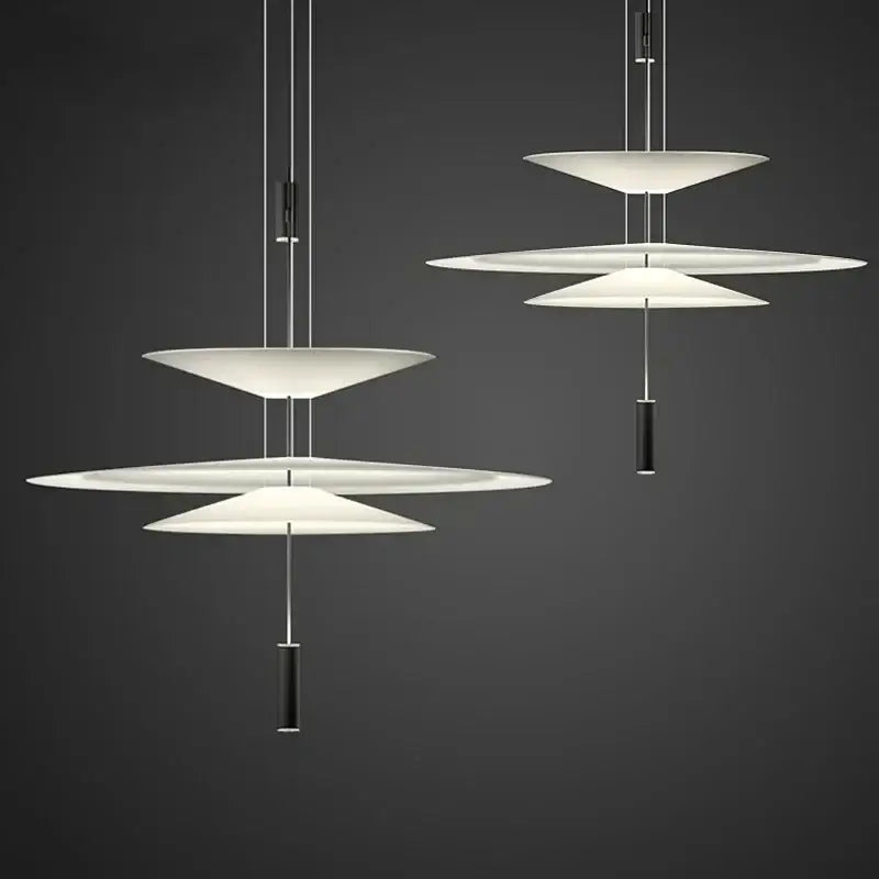 Modern white tiered pendant light with sleek black cylindrical accents decorbites led saucer for living room decor