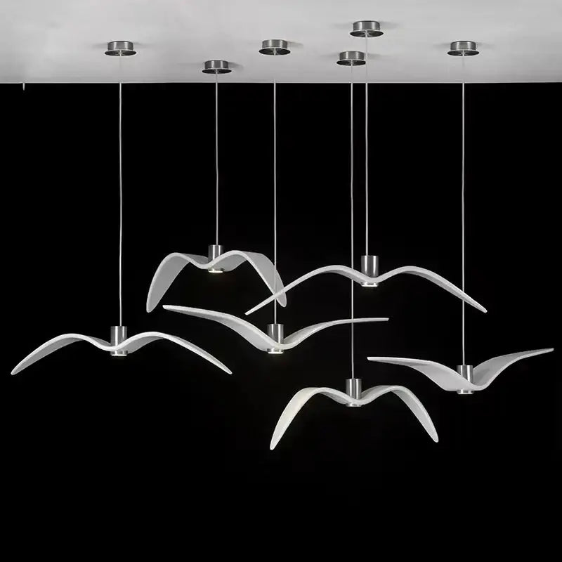 Modern white seagull-shaped pendant lights with sleek metallic fixtures in decorbites led seagull chandelier design