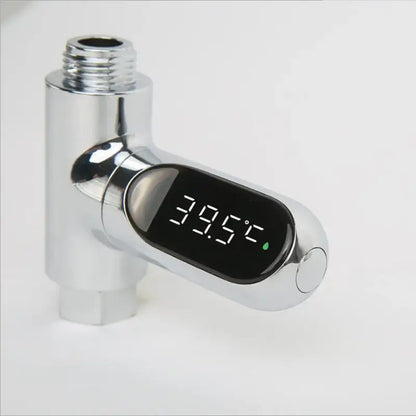 Chrome-finished decorbites led shower thermometer with oval digital display showing 39.5°c and green water droplet icon
