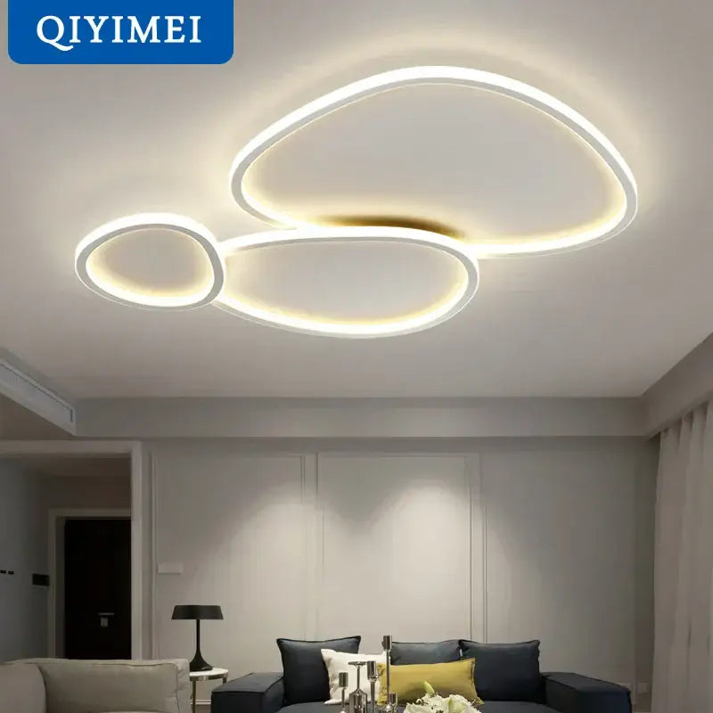Modern white DecorBites LED smart chandeliers with sleek overlapping circular rings and warm glow for bedroom lighting