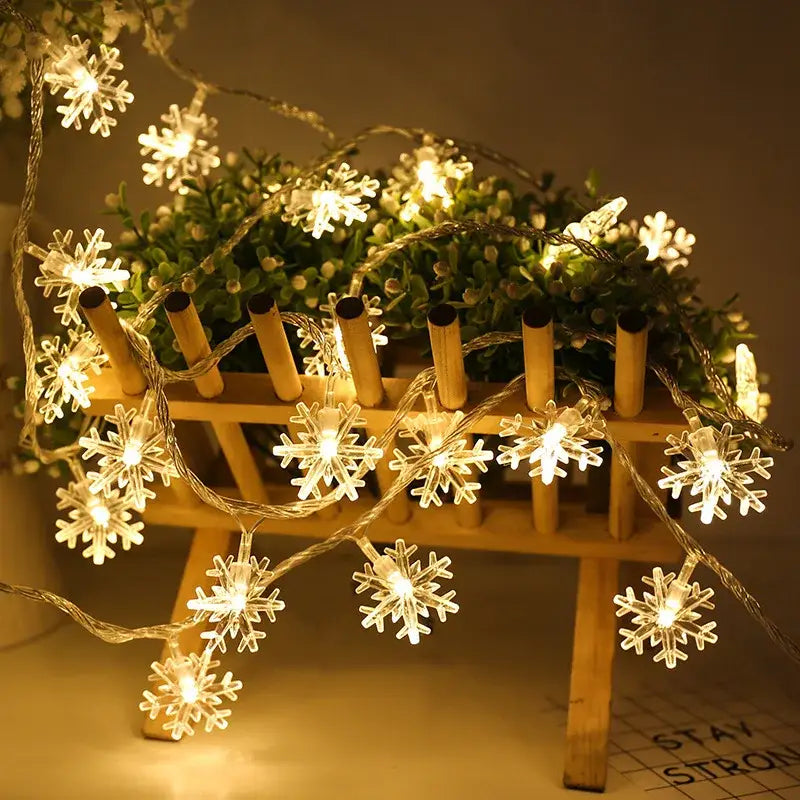 String of warm white led snowflake christmas home decorations with clear plastic bulbs and thin wire by decorbites