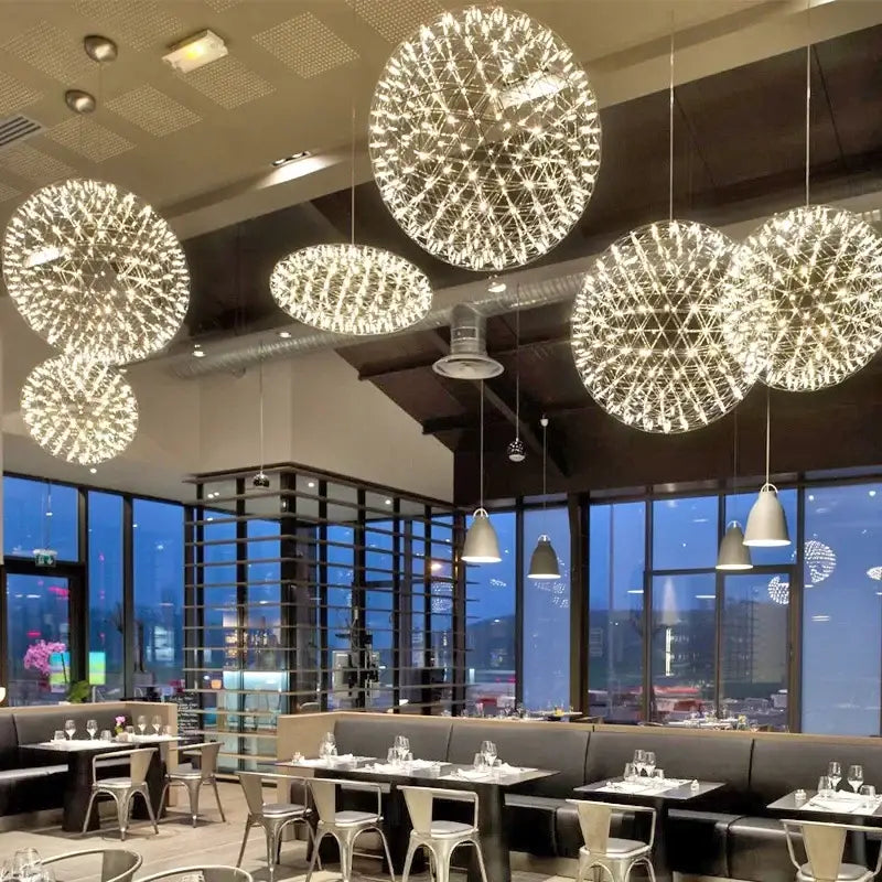 Shimmering decorbites led spark pendant light with warm white led spark ball in modern stainless steel chandelier design