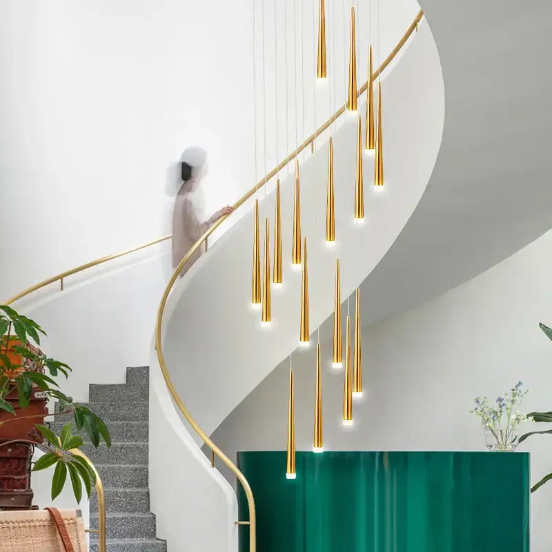 Golden slender decorbites led spiral chandelier in black chrome gold cascade above staircase for stairwell lighting