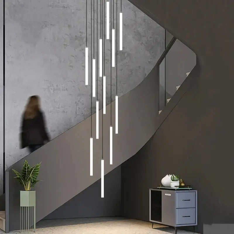 DecorBites™ led spiral staircase chandelier with white cylindrical tubes and slender cords for modern home decor