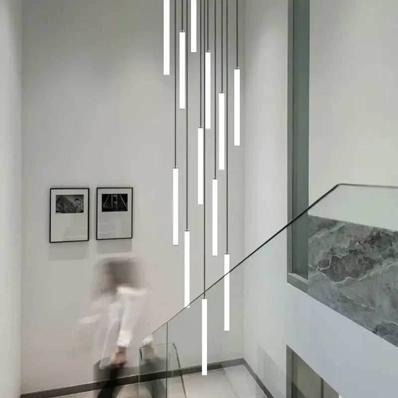 Decorbites™ led spiral staircase chandelier with modern minimalist white cylindrical shades and thin black cords for home lighting