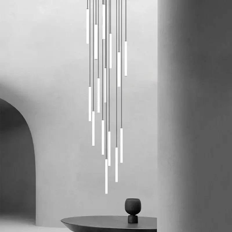 Modern minimalist decorbites led spiral staircase chandelier with slender white cylindrical tubes emitting soft glow