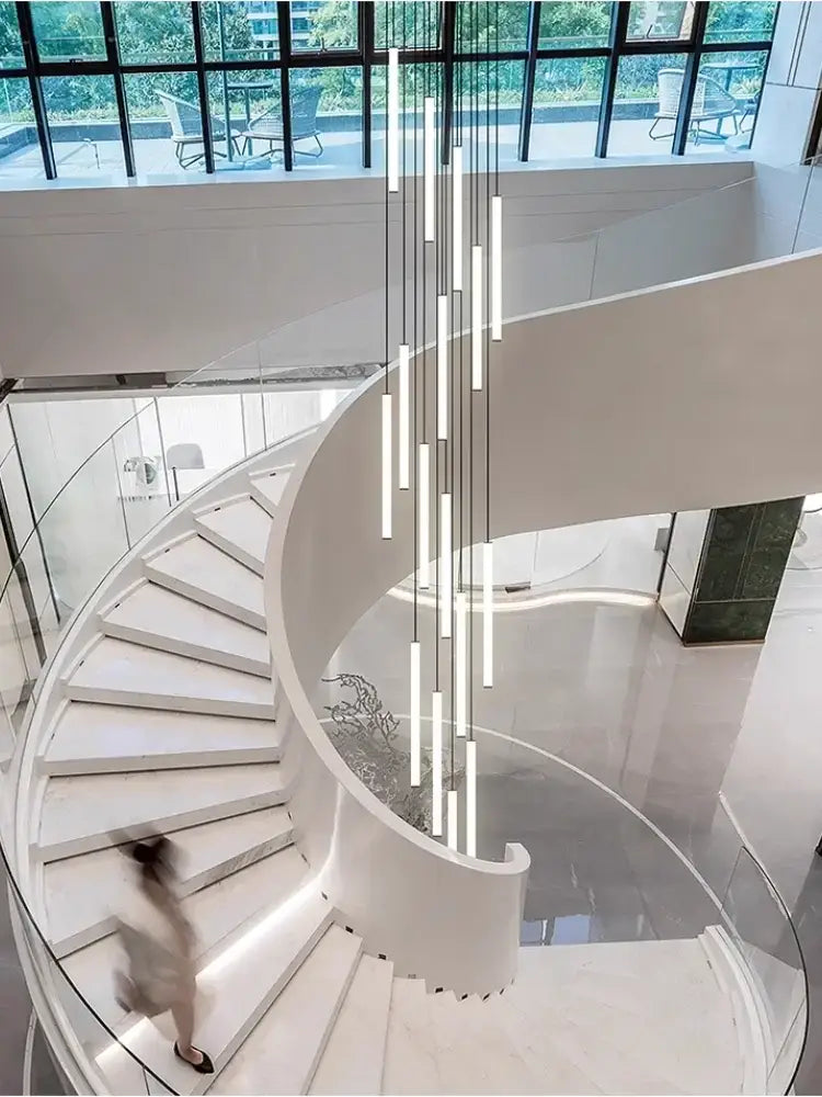 Modern white spiral staircase with glass railings featuring the decorbites led spiral staircase chandelier