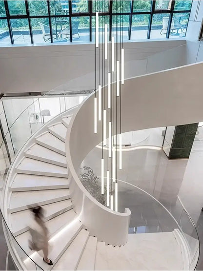 Modern white spiral staircase with glass railings featuring decorbites™ led spiral staircase chandelier for living room