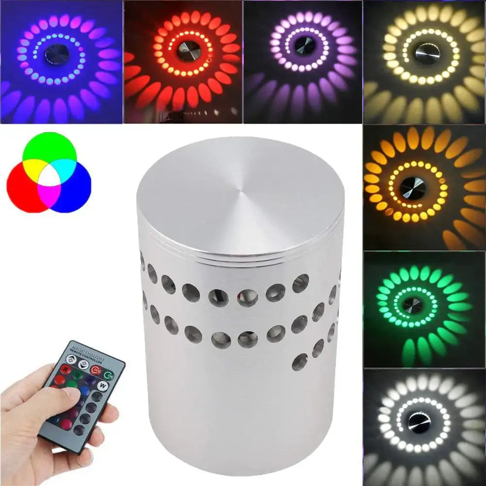 Silver cylindrical DecorBites LED spiral wall light with perforated sides and RGB remote control for color-changing effects