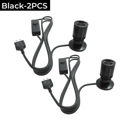 Black cylindrical DecorBites LED spotlight fixtures with integrated power cords and switches for cabinet and ceiling use