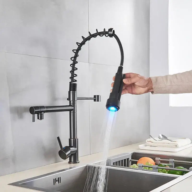 Black matte finish DecorBites LED Spring kitchen faucet with flexible coiled hose and blue LED light nozzle