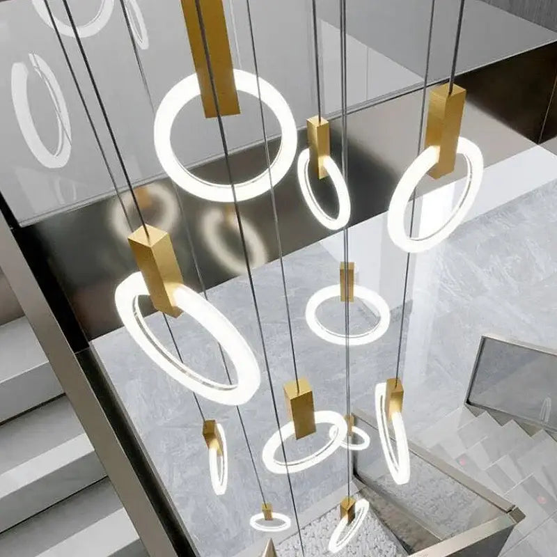 Modern minimalist decorbites led stair chandelier with glowing white rings and gold fixtures for nordic living rooms