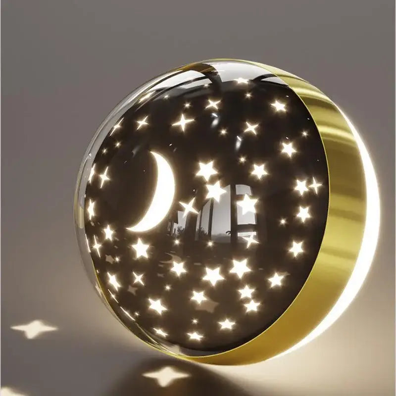 Decorbites led star gold-toned spherical nightlight with crescent moon cutout emitting warm light for children’s rooms