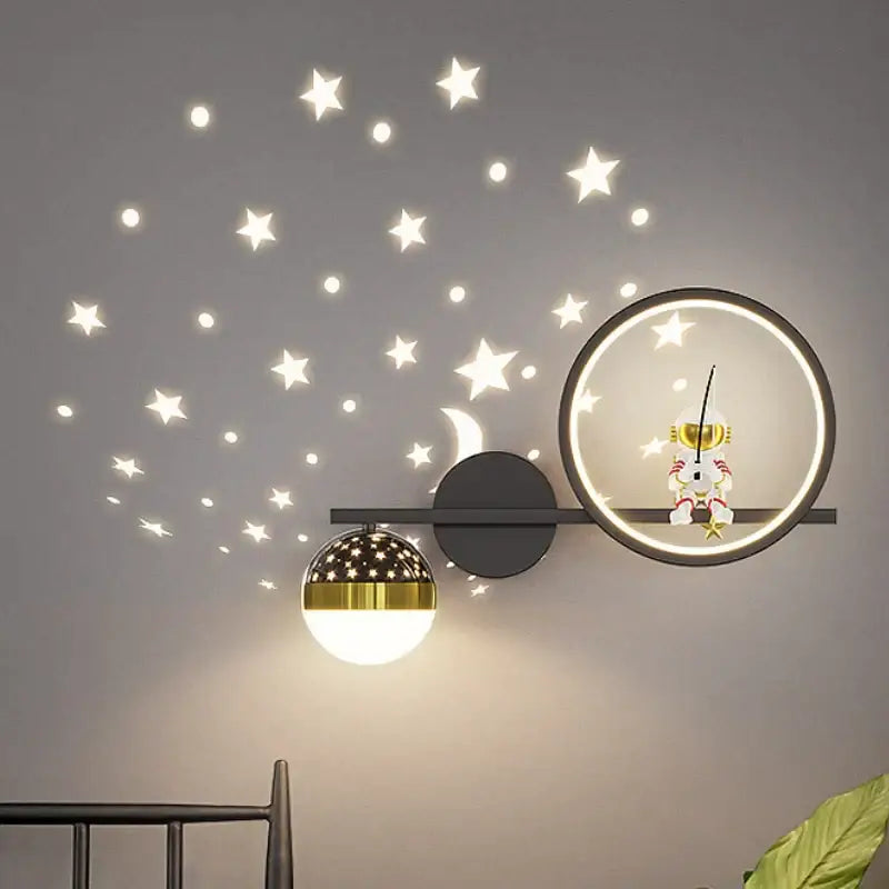 Modern decorbites led star wall light with gold black star-patterned globe and astronaut figurine for children’s rooms