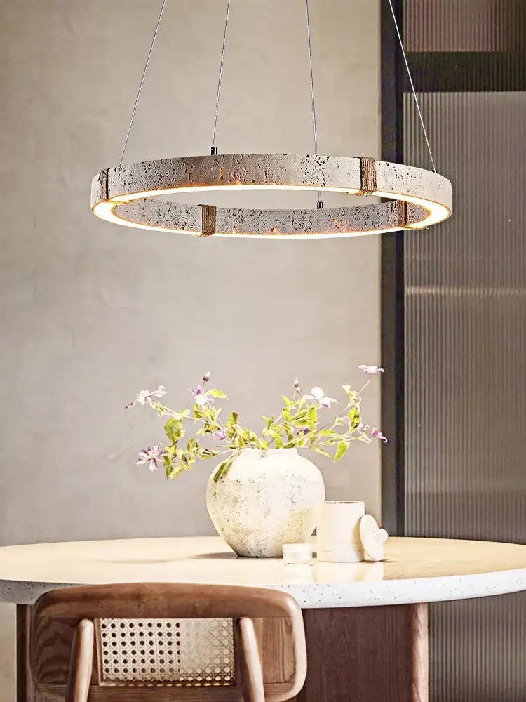 Modern circular DecorBites led stone ring chandelier with speckled concrete finish and warm LED illumination for living room