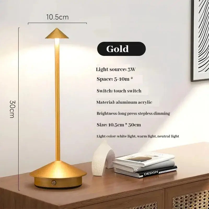 Gold-colored sleek modern led table lamp made of aluminum and acrylic with a cordless touch sensor design