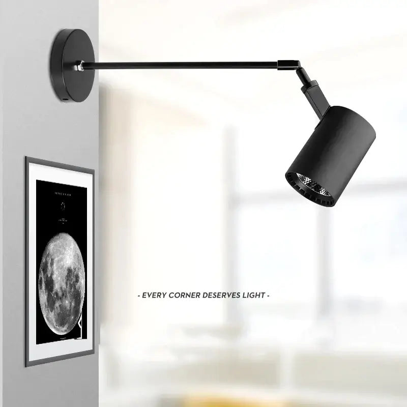 Black matte aluminium decorbites™ telescopic wall lamp with cylindrical head and articulated arm for gallery lighting