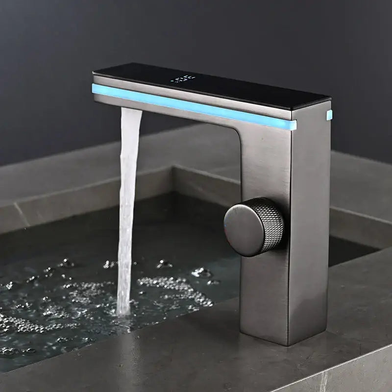 Modern matte black and brushed steel basin faucet with decorbites led temperature display and blue led strip lighting