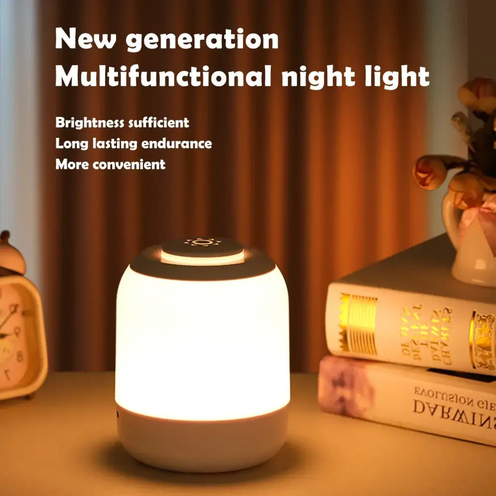 DecorBites™ led touch night light with white cylindrical body black top and soft glowing illumination for baby sleeping