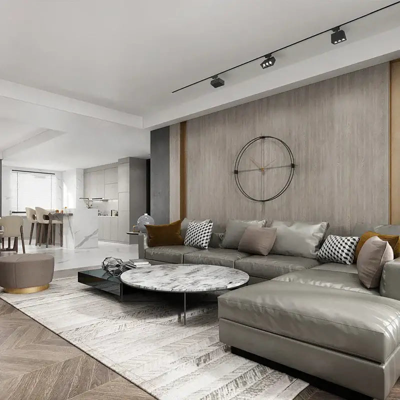 Gray leather sectional sofa with plush cushions and throw pillows showcased under decorbites led track light for home use