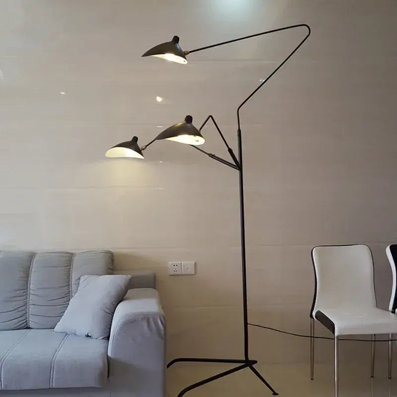 Black metal floor lamp with three articulated arms and angled shield-shaped shades decorbites led tripod floor lamp