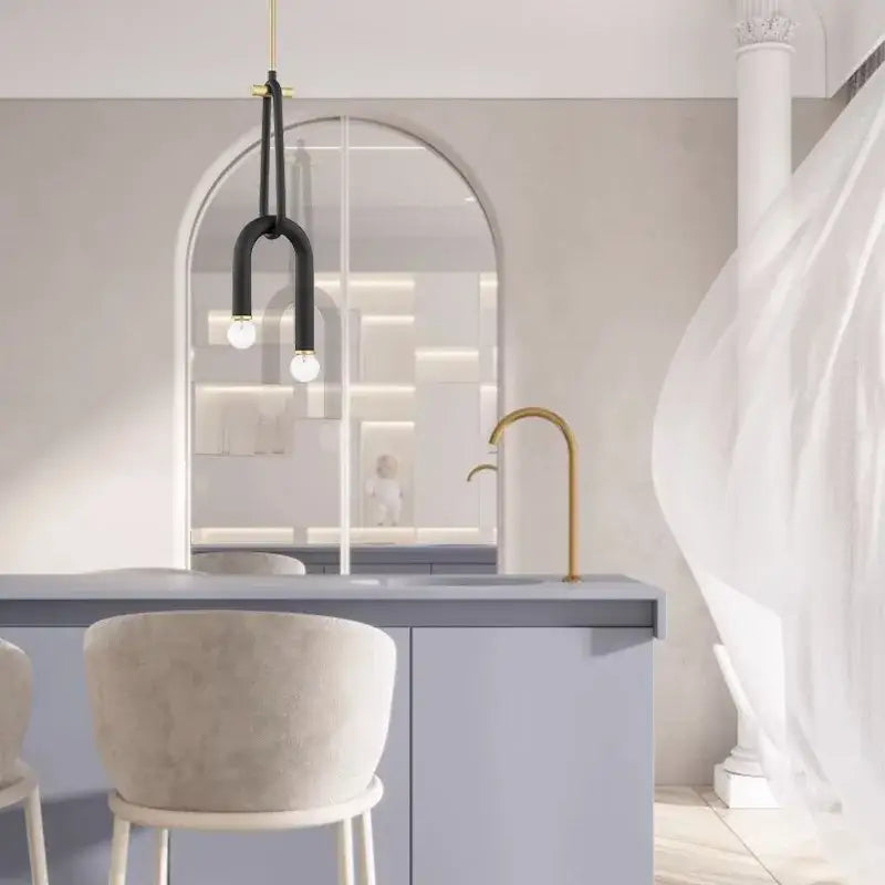 Modern black and gold decorbites led tube chandelier lighting hanging above minimalist kitchen island for home deco