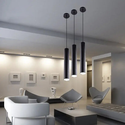 Three sleek black decorbites led tube pendant lights with modern finish for dining room and bar lighting