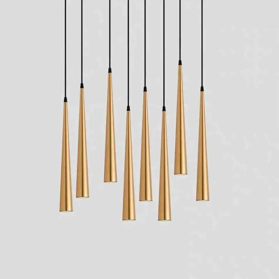 A set of modern gold-toned DecorBites LED tube pendant lights with sleek cylindrical shades for kitchen and dining