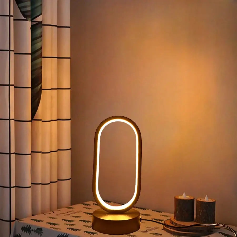Golden oval-shaped led table lamp by decorbites with sleek modern design providing warm ambient light for lamp bedroom bedside use