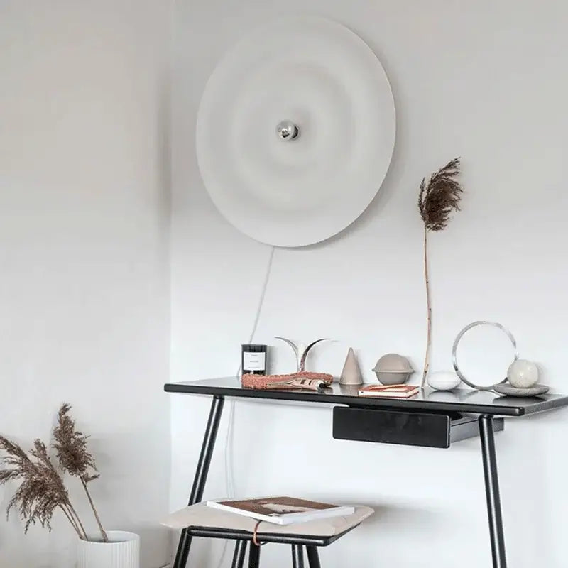 Decorbites led white circular wall sconce with a minimalist metallic center for living room ambient lighting